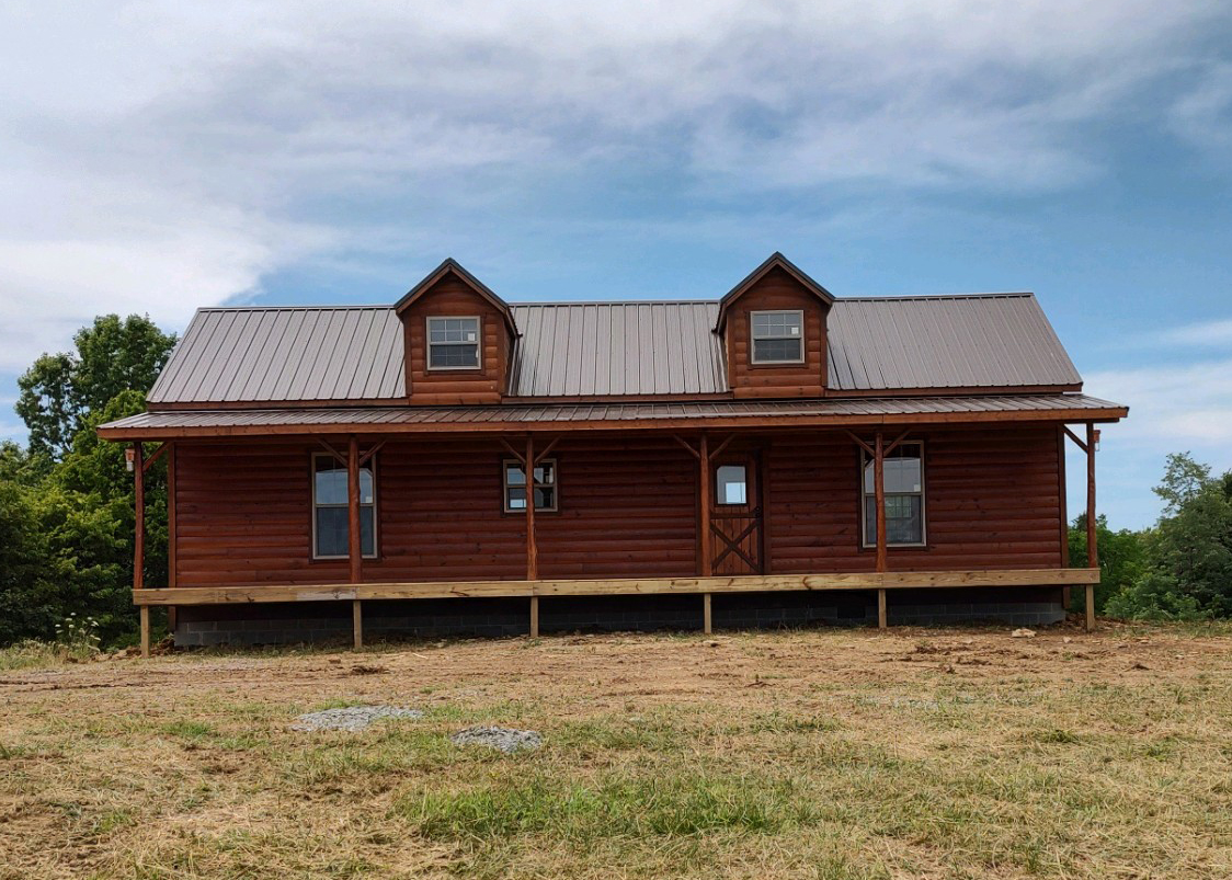 Log with two dormers